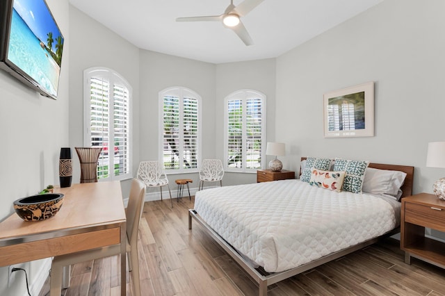 9350 Eden Roc Ct, Delray Beach, FL 33446 - bedroom with wood finished floors, a ceiling fan, and baseboards