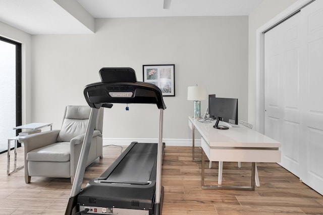 9350 Eden Roc Ct, Delray Beach, FL 33446 - workout area featuring wood finished floors and baseboards