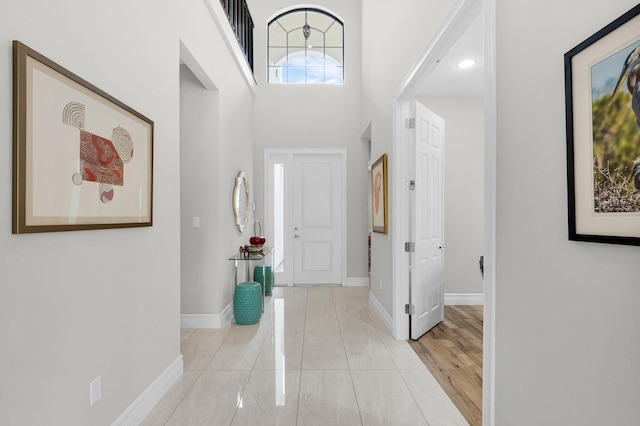 9350 Eden Roc Ct, Delray Beach, FL 33446 - foyer featuring baseboards and a towering ceiling