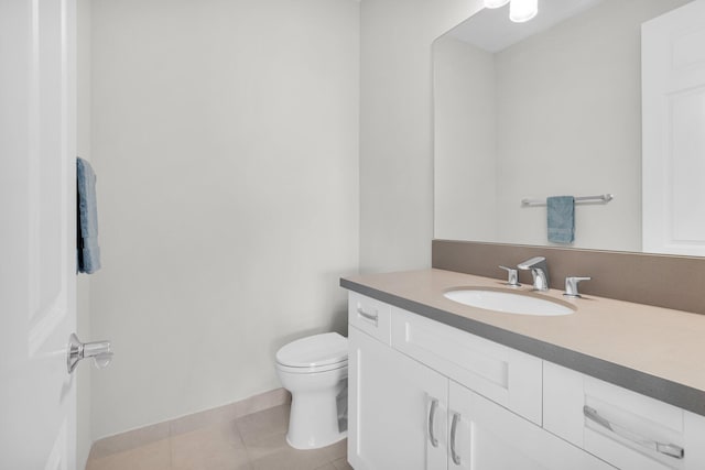 9350 Eden Roc Ct, Delray Beach, FL 33446 - bathroom featuring vanity, toilet, tile patterned flooring, and baseboards
