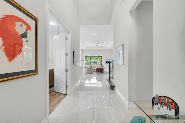 9350 Eden Roc Ct, Delray Beach, FL 33446 - hall featuring baseboards, recessed lighting, a raised ceiling, and tile patterned floors