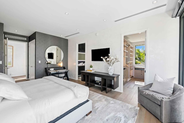 121 2nd Dilido Ter Share B, Unit Share B, Miami Beach, FL 33139 - bedroom featuring wood finished floors and connected bathroom
