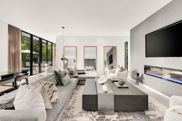 121 2nd Dilido Ter Share B, Unit Share B, Miami Beach, FL 33139 - living area featuring a wall of windows, a glass covered fireplace, and recessed lighting