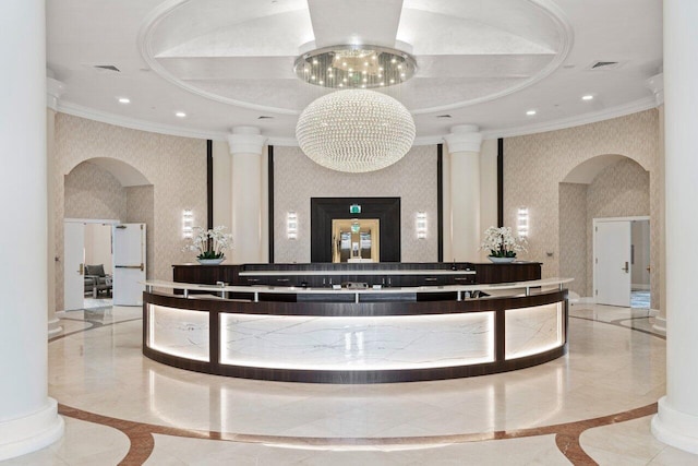 3700 S Ocean Blvd Unit 1210, Highland Beach, FL 33487 - reception area featuring arched walkways, ornamental molding, ornate columns, wallpapered walls, and recessed lighting
