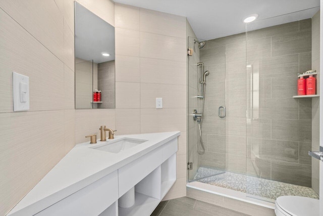 3700 S Ocean Blvd Unit 1210, Highland Beach, FL 33487 - full bath with tile walls, toilet, vanity, and a shower stall