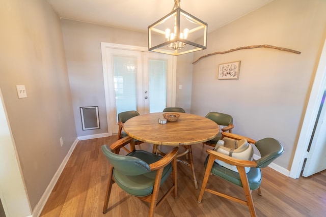 1793 SW 22nd Ter, Okeechobee, FL 34974 - dining space with light wood-type flooring, a chandelier, baseboards, and french doors