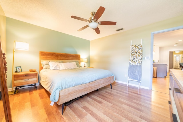 1793 SW 22nd Ter, Okeechobee, FL 34974 - bedroom with light wood finished floors, baseboards, and a ceiling fan
