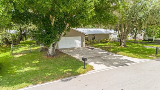1793 SW 22nd Ter, Okeechobee, FL 34974 - view of front of home featuring concrete driveway, a garage, and stucco siding