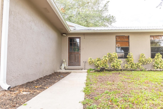 1793 SW 22nd Ter, Okeechobee, FL 34974 - entrance to property featuring stucco siding and metal roof
