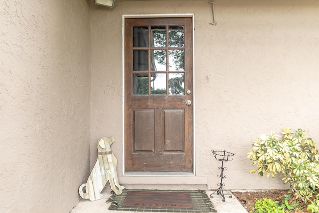 1793 SW 22nd Ter, Okeechobee, FL 34974 - doorway to property with stucco siding