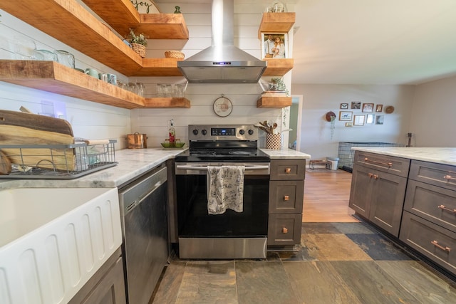 1793 SW 22nd Ter, Okeechobee, FL 34974 - kitchen featuring appliances with stainless steel finishes, island exhaust hood, open shelves, and light stone countertops