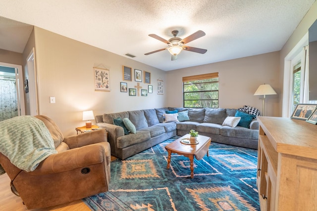 1793 SW 22nd Ter, Okeechobee, FL 34974 - living room with a ceiling fan, a textured ceiling, and wood finished floors