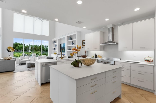 6636 Dana Point Cv, Delray Beach, FL 33446 - kitchen featuring wall chimney exhaust hood, dishwasher, a center island, a sink, and light countertops
