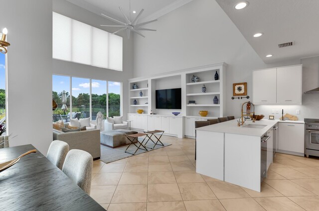 6636 Dana Point Cv, Delray Beach, FL 33446 - kitchen with a towering ceiling, a sink, light tile patterned floors, a ceiling fan, and recessed lighting