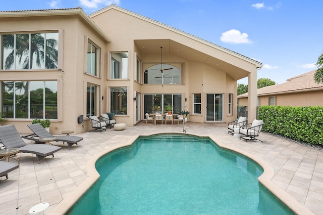 6636 Dana Point Cv, Delray Beach, FL 33446 - rear view of property featuring stucco siding and a patio