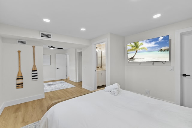 2137 Longwood Rd, West Palm Beach, FL 33409 - bedroom with wood finished floors, baseboards, recessed lighting, and ensuite bathroom