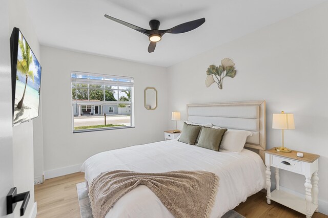 2137 Longwood Rd, West Palm Beach, FL 33409 - bedroom featuring wood finished floors, baseboards, and a ceiling fan