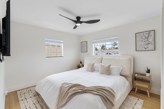 2137 Longwood Rd, West Palm Beach, FL 33409 - bedroom with light wood-style floors, baseboards, and a ceiling fan