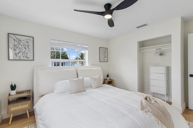 2137 Longwood Rd, West Palm Beach, FL 33409 - bedroom with light wood-style flooring, a ceiling fan, a closet, and baseboards