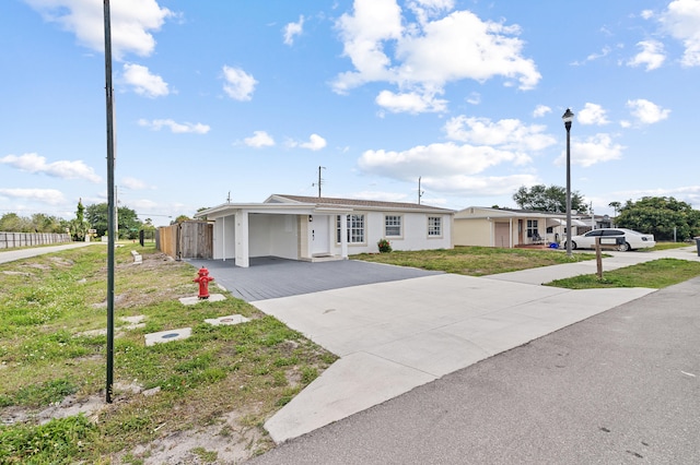 2137 Longwood Rd, West Palm Beach, FL 33409 - single story home with driveway and stucco siding