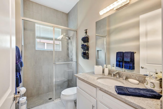 11051 SW Ivory Springs Ln, Port Saint Lucie, FL 34987 - bathroom with vanity, a shower stall, and toilet