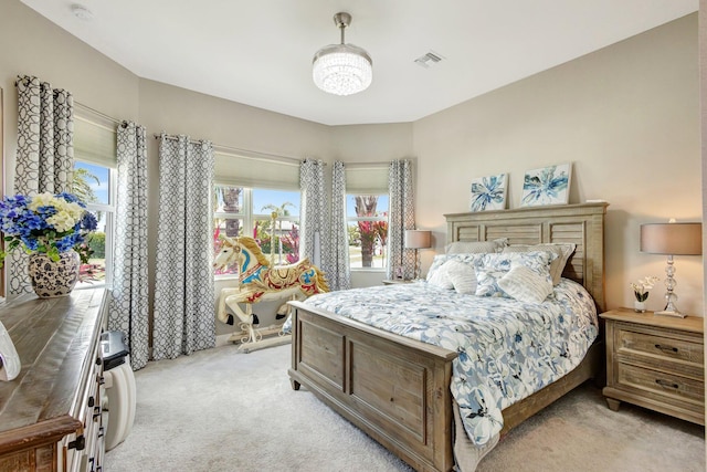 11051 SW Ivory Springs Ln, Port Saint Lucie, FL 34987 - bedroom featuring light carpet and multiple windows