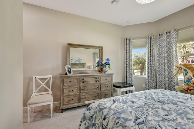11051 SW Ivory Springs Ln, Port Saint Lucie, FL 34987 - bedroom with multiple windows, light carpet, and baseboards