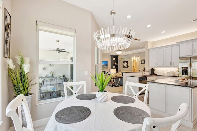 11051 SW Ivory Springs Ln, Port Saint Lucie, FL 34987 - dining space with a chandelier, recessed lighting, a ceiling fan, and baseboards