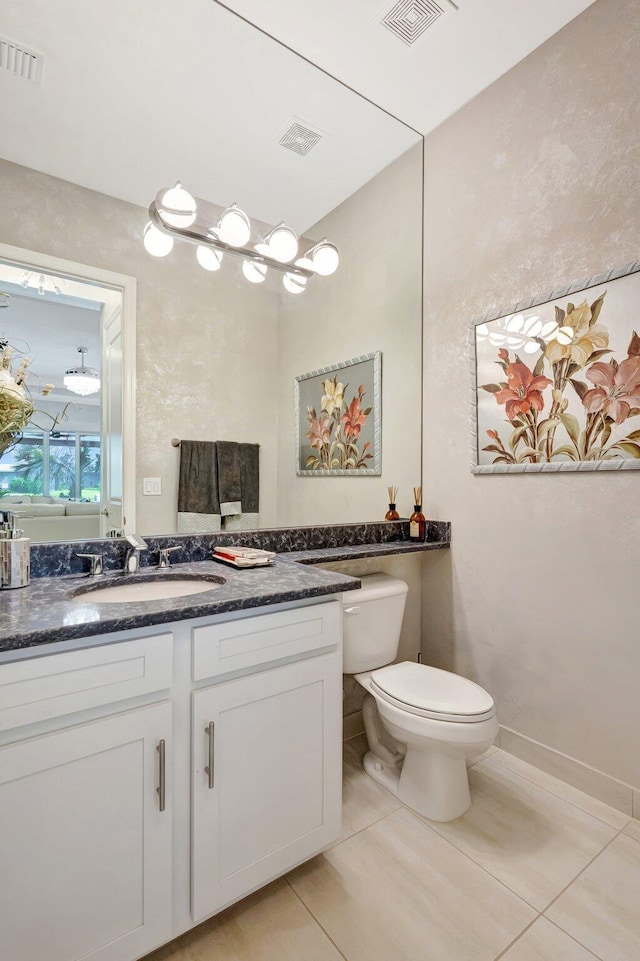 11051 SW Ivory Springs Ln, Port Saint Lucie, FL 34987 - bathroom with toilet, tile patterned flooring, and vanity