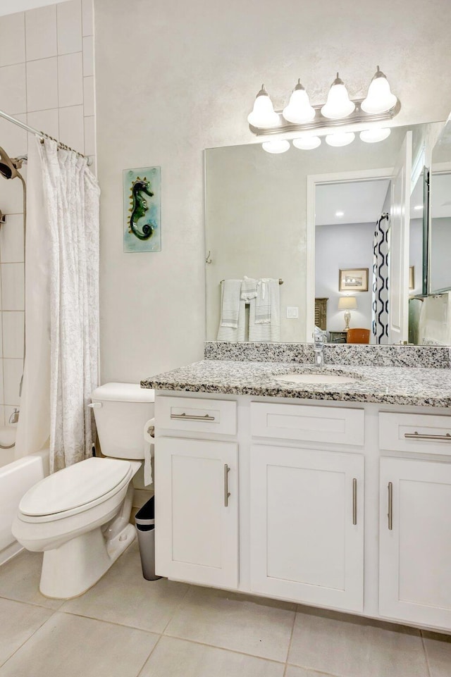 11051 SW Ivory Springs Ln, Port Saint Lucie, FL 34987 - full bathroom with tile patterned floors, vanity, toilet, and shower / tub combo with curtain