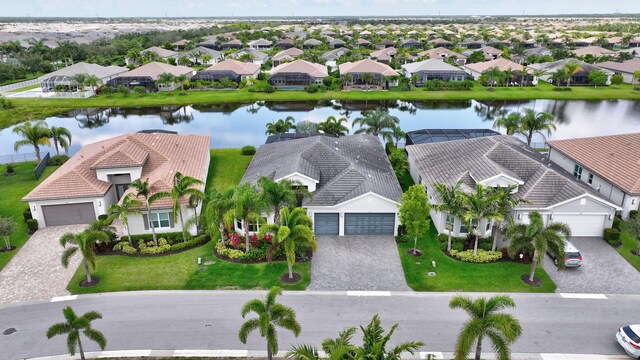 11051 SW Ivory Springs Ln, Port Saint Lucie, FL 34987 - aerial perspective of suburban area with a large body of water