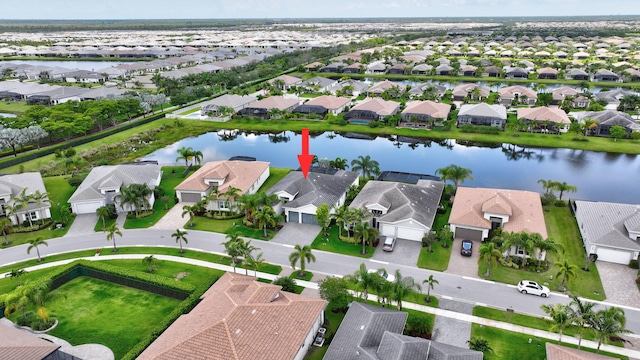 11051 SW Ivory Springs Ln, Port Saint Lucie, FL 34987 - aerial view of residential area with a nearby body of water