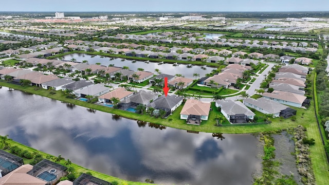 11051 SW Ivory Springs Ln, Port Saint Lucie, FL 34987 - aerial view of property's location with nearby suburban area and a large body of water