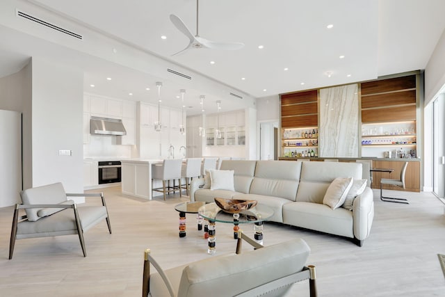 1 N Ocean Blvd Unit Ph05, Pompano Beach, FL 33062 - living room featuring a ceiling fan, recessed lighting, and light wood-type flooring