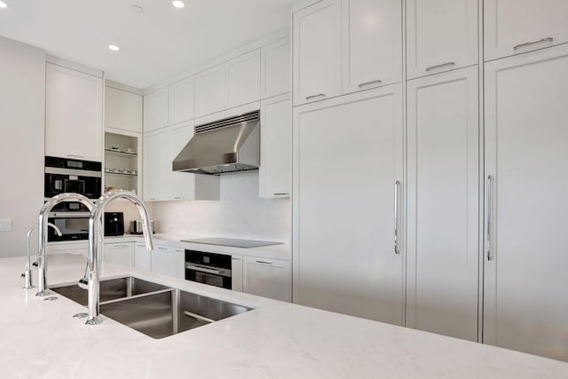 1 N Ocean Blvd Unit Ph05, Pompano Beach, FL 33062 - kitchen with range hood, white cabinetry, recessed lighting, a sink, and black appliances