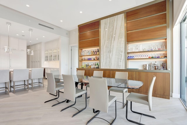 1 N Ocean Blvd Unit Ph05, Pompano Beach, FL 33062 - dining space featuring light wood-style flooring, a dry bar, and recessed lighting