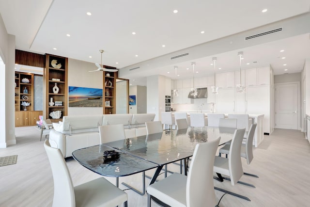 1 N Ocean Blvd Unit Ph05, Pompano Beach, FL 33062 - dining room with light wood-style floors, recessed lighting, and built in features