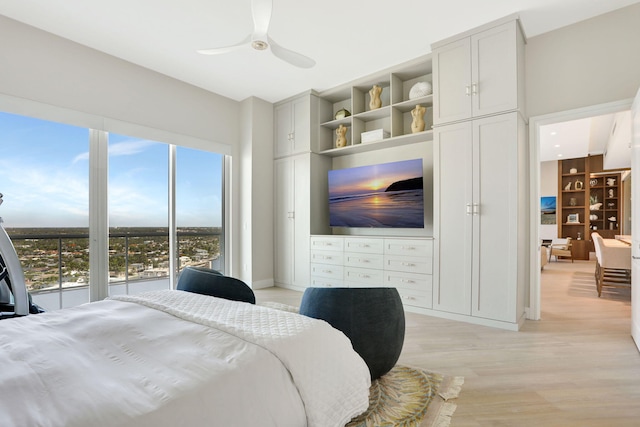 1 N Ocean Blvd Unit Ph05, Pompano Beach, FL 33062 - bedroom featuring light wood-type flooring, a ceiling fan, two closets, and baseboards