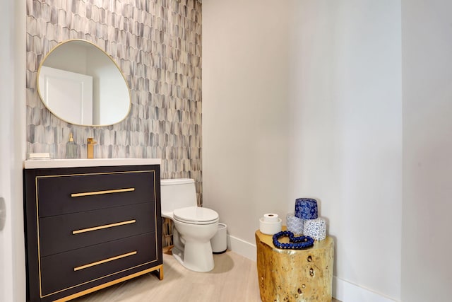 1 N Ocean Blvd Unit Ph05, Pompano Beach, FL 33062 - half bath featuring toilet, vanity, baseboards, and wood finished floors