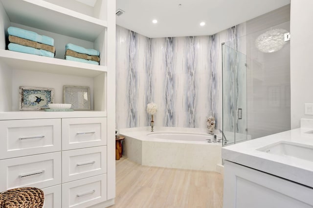 1 N Ocean Blvd Unit Ph05, Pompano Beach, FL 33062 - bathroom with a bath, a marble finish shower, vanity, wood finished floors, and recessed lighting