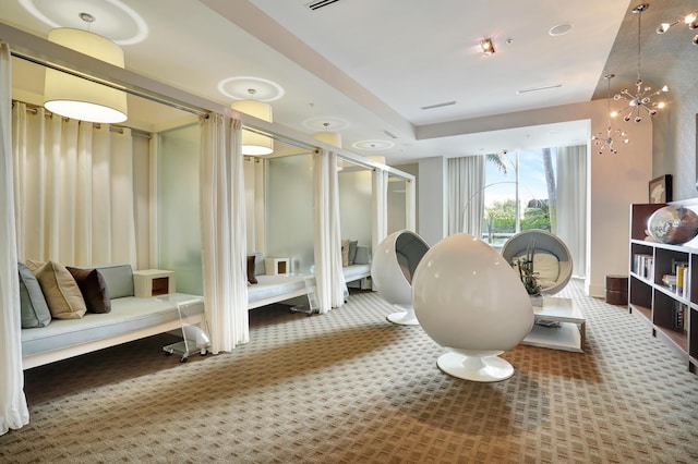 1 N Ocean Blvd Unit Ph05, Pompano Beach, FL 33062 - bathroom featuring a stall shower and a chandelier