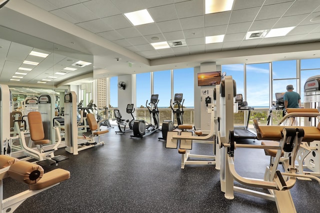 1 N Ocean Blvd Unit Ph05, Pompano Beach, FL 33062 - exercise room featuring a drop ceiling and a wall of windows