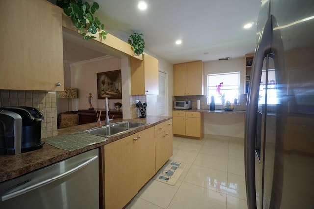 1902 SW 16th Ave, Boynton Beach, FL 33426 - kitchen with appliances with stainless steel finishes, a sink, backsplash, light brown cabinetry, and light tile patterned flooring