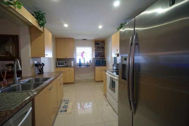 1902 SW 16th Ave, Boynton Beach, FL 33426 - kitchen featuring stainless steel appliances, a sink, light brown cabinets, decorative backsplash, and recessed lighting
