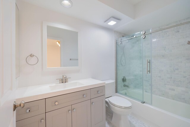 12236 Sag Harbor Ct Unit 3, Wellington, FL 33414 - bathroom featuring toilet, vanity, and bath / shower combo with glass door