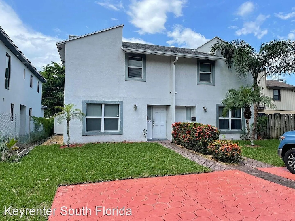 607 SW 6th St, Fort Lauderdale, FL 33315 - back of house featuring stucco siding