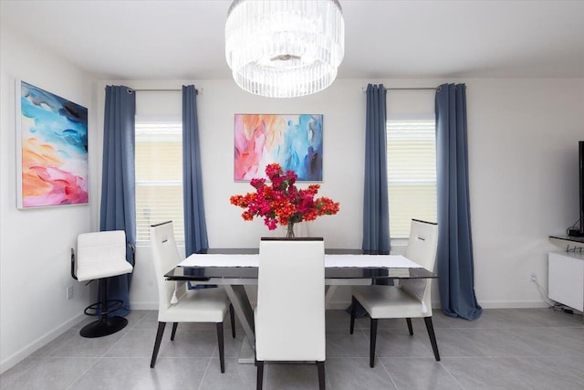 12314 SW Rimini Way, Port Saint Lucie, FL 34987 - dining room with tile patterned floors, a chandelier, and baseboards
