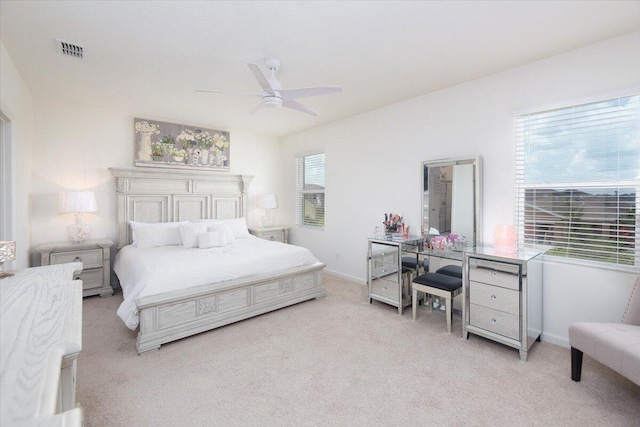 12314 SW Rimini Way, Port Saint Lucie, FL 34987 - bedroom with light colored carpet, baseboards, and a ceiling fan