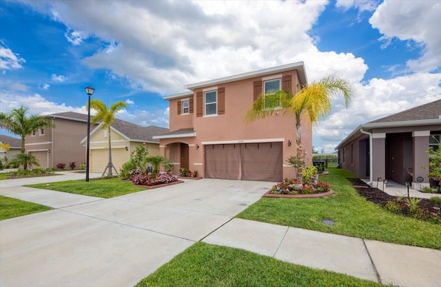 12314 SW Rimini Way, Port Saint Lucie, FL 34987 - view of front facade featuring stucco siding, driveway, an attached garage, and a front lawn