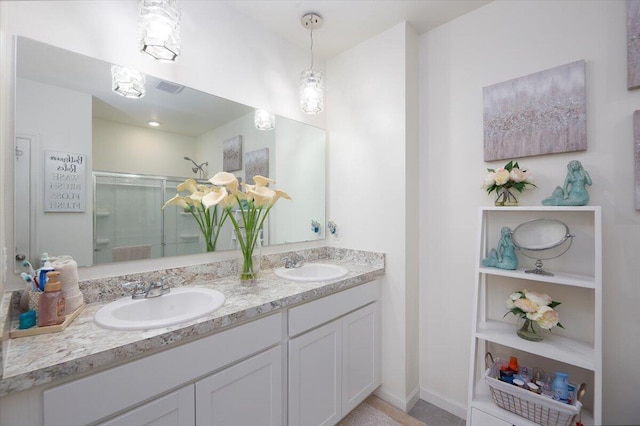 12314 SW Rimini Way, Port Saint Lucie, FL 34987 - full bath featuring a shower stall, double vanity, and baseboards